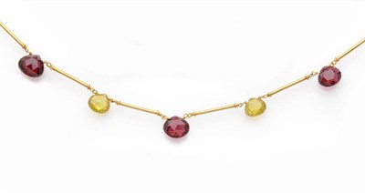 Lot 448 - A Garnet and Sphene Tube Link Necklace, triangular briolette cut drops of alternating garnet...