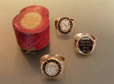 Lot 459 - A Set of Three Mourning Rings, each encloses plaited hair within faceted jet on a swivel head,...