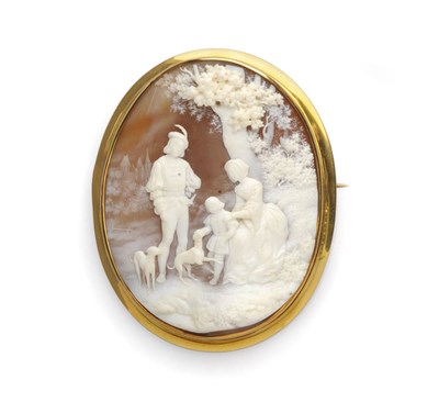 Lot 466 - A Large Cameo Brooch, the cameo carved with a family scene in 16th century dress, a maiden...