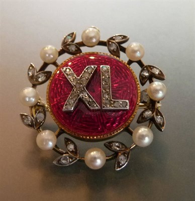 Lot 473 - A Monogram Brooch, a circular red guilloche enamel centre has an applied monogram 'XL', in rose cut