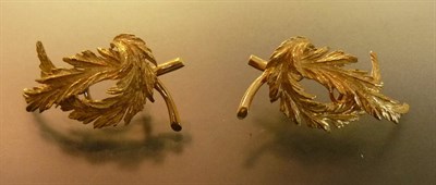 Lot 483 - A Pair of 18 Carat Gold Earrings, in the form of leaves, with clip-on fittings, measure 2.1cm...