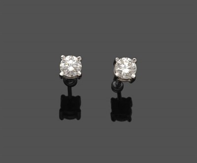 Lot 492 - A Pair of 18 Carat White Gold Diamond Solitaire Stud Earrings, the round brilliant cut diamonds...