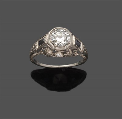 Lot 497 - An Art Deco Diamond Solitaire Ring, the round brilliant cut diamond in a chunky engraved and...