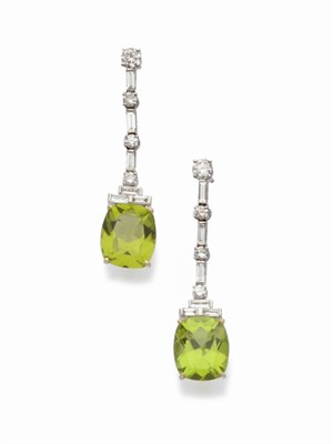 Lot 503 - A Pair of 18 Carat White Gold Peridot and Diamond Drop Earrings, a round brilliant cut diamond...