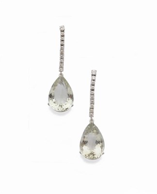 Lot 509 - A Pair of 18 Carat White Gold Green Amethyst and Diamond Drop Earrings, a round brilliant cut...