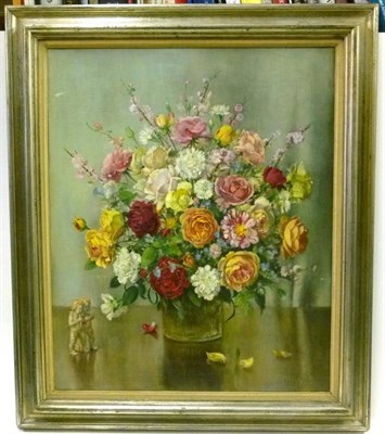 Lot 1188 - M.E Wilson (20th century) Still life of a vase of flowers with cherubs Signed, oil on canvas,...