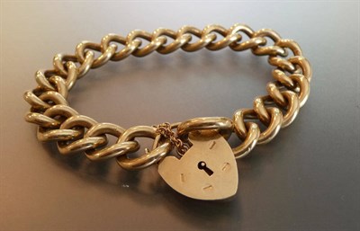 Lot 517 - A 9 Carat Gold Curb and Lock Bracelet, each link stamped '9.375', length 21cm.