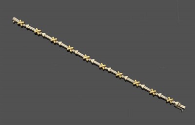 Lot 523 - An 18 Carat Gold Diamond Line Bracelet, white arrows with diamonds inset, and plain polished...