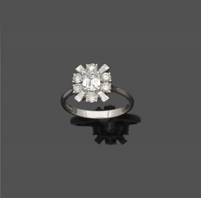 Lot 524 - An 18 Carat White Gold Fancy Diamond Cluster Ring, an emerald-cut diamond within a border of...