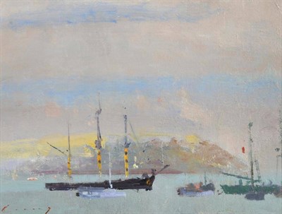 Lot 1138 - Frederick Cuming RA (b.1930)  Sail boats moored off a coastline Signed, oil on board, 14cm by 19cm