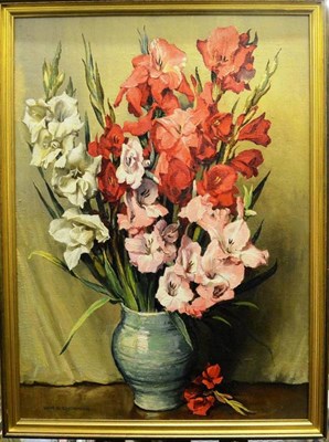 Lot 1255 - WRE Goodrich (20th century) Still life of gladioli in a green vase Signed, oil on board, 60cm...