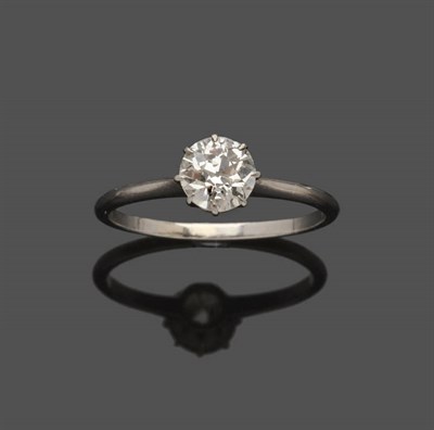 Lot 543 - A Diamond Solitaire Ring, the old brilliant cut stone held in a white eight claw setting, to a...