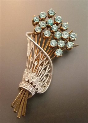 Lot 550 - A Zircon and Diamond Set Sheaf Brooch, round brilliant cut blue zircons claw set at one end,...