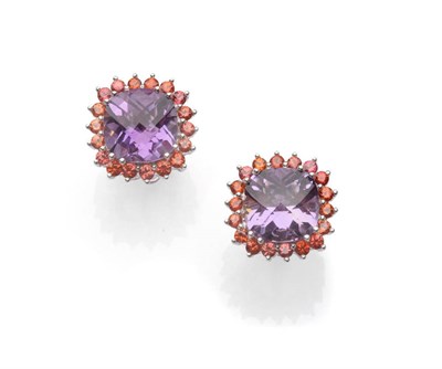 Lot 554 - A Pair of Amethyst and Orange Sapphire Cluster Earrings, Dutch rose cut amethysts within a...