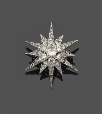 Lot 570 - A Victorian Diamond Star Brooch, an old cut diamond centres six long and six short radial arms,...