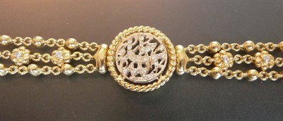 Lot 580 - A Diamond Bracelet, the central pierced panel set with round brilliant cut diamonds, within an...