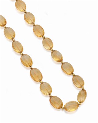 Lot 586 - A Citrine Necklace, the graduated faceted oval beads spaced by small rondels, length 50.5cm.