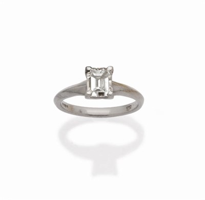 Lot 588 - A Platinum Diamond Solitaire Ring, the emerald-cut diamond in a four claw setting, to a knife...