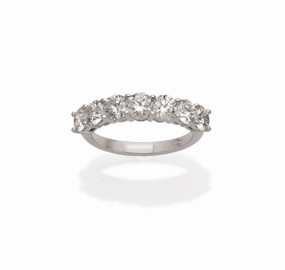 Lot 591 - An 18 Carat White Gold Diamond Seven Stone Ring, the round brilliant cut diamonds held in claw...