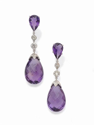 Lot 592 - A Pair of Amethyst and Diamond Drop Earrings, a Dutch rose cut pear shaped amethyst suspends a pair