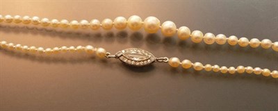 Lot 598 - A Pearl Necklace with a Diamond Clasp, the one hundred and forty round and off-round pearls are...