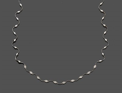 Lot 604 - An 18 Carat White Gold Diamond Set Necklace, alternating wavy links spaced by lozenge shaped links