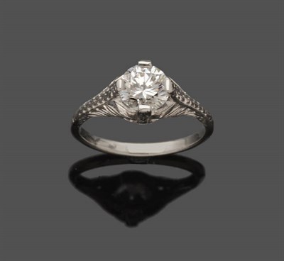 Lot 615 - A Diamond Solitaire Ring, the round brilliant cut diamond in a white four claw setting in a pierced