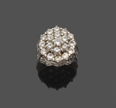 Lot 643 - An 18 Carat White Gold Diamond Cluster Ring, three tiers of round brilliant cut diamonds in...