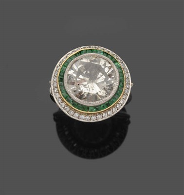 Lot 648 - A Diamond and Emerald Cluster Ring, a round brilliant cut diamond within a double border of...