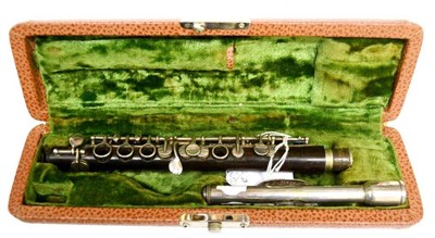 Lot 2072 - A Rosewood Piccolo, inscribed 'Dolnet Lefevre & Picis Mantes', with silver plated keys and...