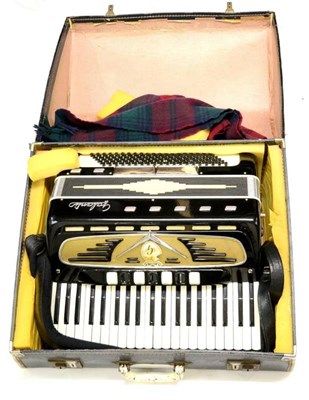 Lot 2114 - A Galanti Piano Accordion, with black and white body, cased