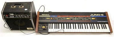 Lot 2120 - A Roland Juno-6 Polyphonic Synthesizer JU-6, with a stand and a Badger Minuet amplifier (2)