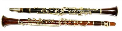 Lot 2041 - Two Rosewood Clarinets, one by P Geubel, the other unnamed, with nickel mounts and keys