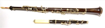 Lot 2042 - A Rosewood Oboe by Dan Godfrey & Sons, 428 Strand, London, with nickel keys, damaged mouthpiece; An