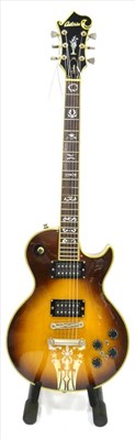 Lot 2071 - An Antoria Custom Les Paul Style Guitar, with torch inlaid scroll headstock, two piece laminate...