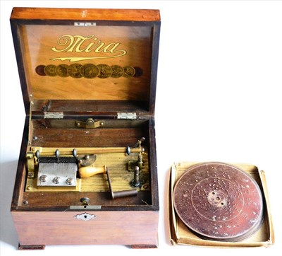 Lot 2126 - Mira Disc Musical Box with single comb movement in oak case with 'Mira' logo inside lid; with a box