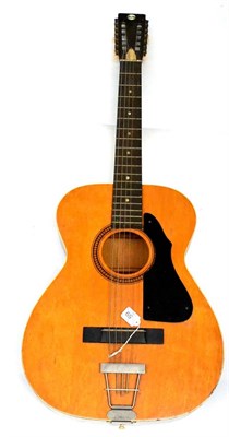 Lot 59 - A 1960s Harmony Stella Twelve String Guitar, with brown jumbo body, brown finish back, sides...