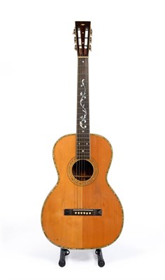 Lot 63 - A 1930s Regal Parlour Guitar, with fancy half vine mother-of-pearl inlay to the ebony...