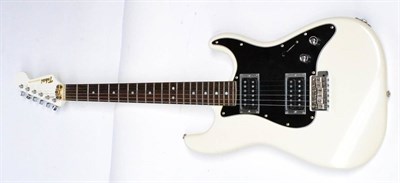 Lot 93 - A 1980s Tokai Solid Bodied Strat Style Guitar, in white, with twin humbucking pick-ups, tone volume