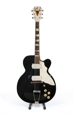 Lot 107 - A Kay Upbeat, circa 1958, with single cutaway black finish body, Art Deco style headstock with...