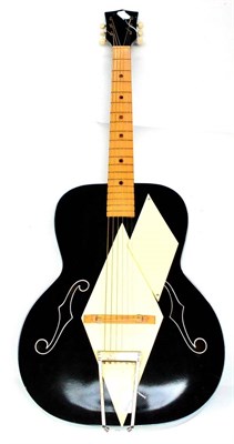 Lot 127 - A 1960s Kay Airline Diamond Top Acoustic Guitar, black finish with cream diamond top and...