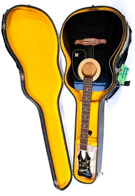 Lot 148 - A 1960s Harmony Sovereign Guitar, with black finish body, rosewood moustache pin bridge,...