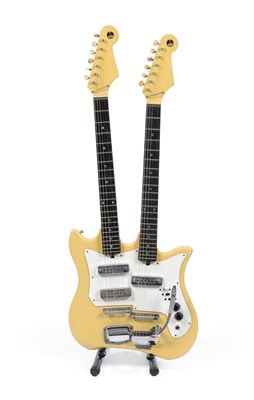 Lot 151 - A 1960s Teisco Twin Neck Guitar, with cream finish body, twin six string necks, the upper neck with