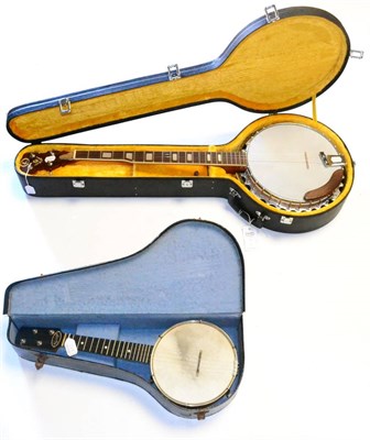 Lot 225 - A Kay 4-String Banjo, the rosewood resonator decorated with an eagle, in a plush lined case,...