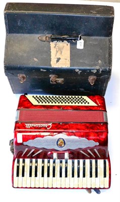 Lot 234 - An Italian Crucianelli Piano Accordion, with red faux pearl covered body, cased