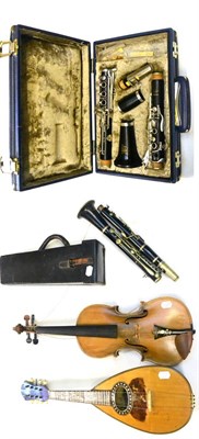 Lot 28 - Four Musical Instruments, comprising a 19th century German violin, an Italian bowl-back mandolin, a