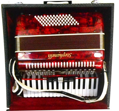 Lot 66 - A Stephanelli Piano Accordion, with red pearl body, in a fitted case