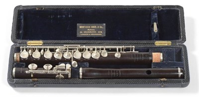 Lot 39 - J Mollenhauer E  Flute in African black wood with chromed keys, in Montague Bros. & Co case and...