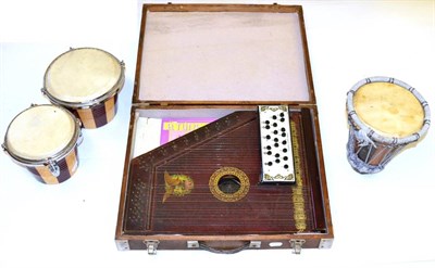 Lot 83 - Three Instruments, comprising a pair of tom-toms, a drum and a cased zither