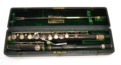 Lot 2033 - Victorian Rudall, Carte & Co. Ltd. rosewood flute  in three sections, each individually...